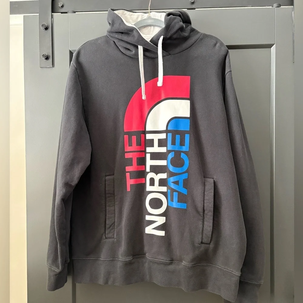 The North Face Men's Black Hoodie with Red and Blue Logo